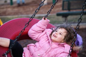Emily on the tire swing