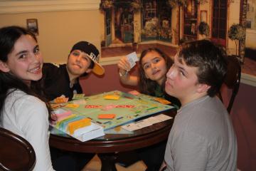 Kids play monopoly